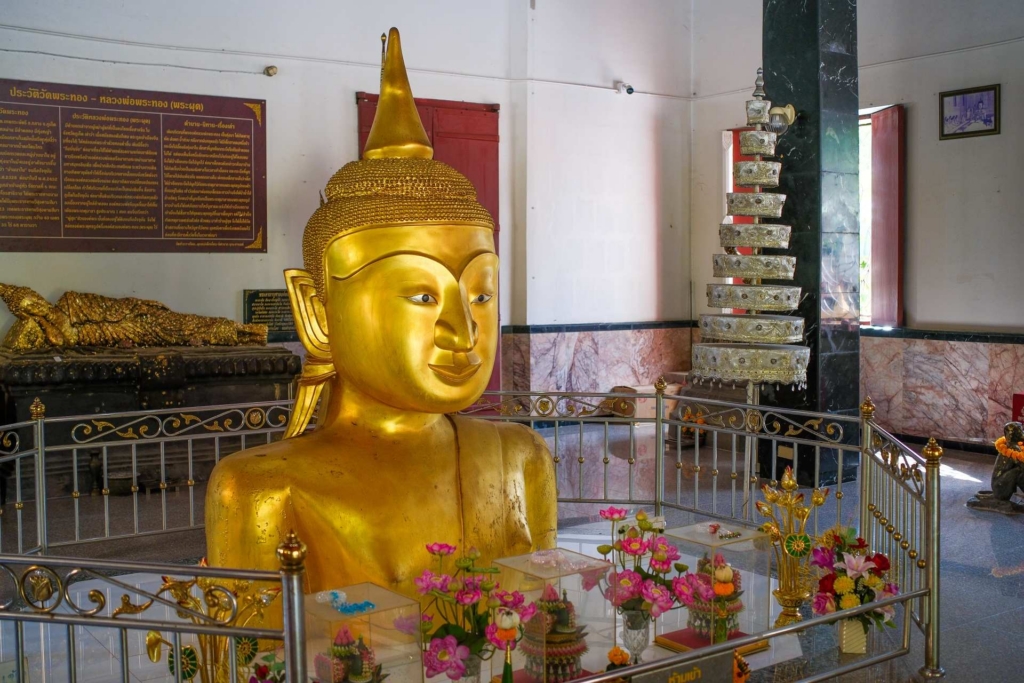 The Golden Buddha with Half of its Body Buried Undeground